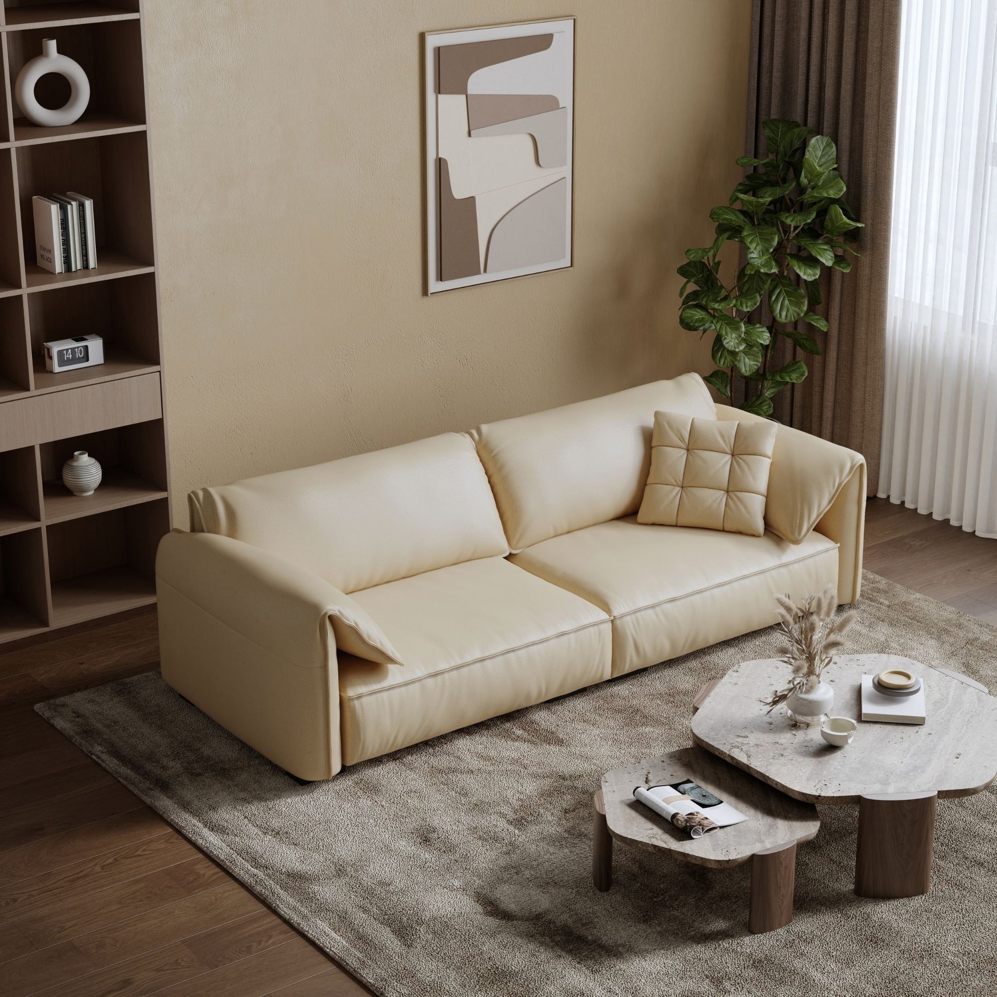 Beige sofa in a living room with a coffee table and decorative items.