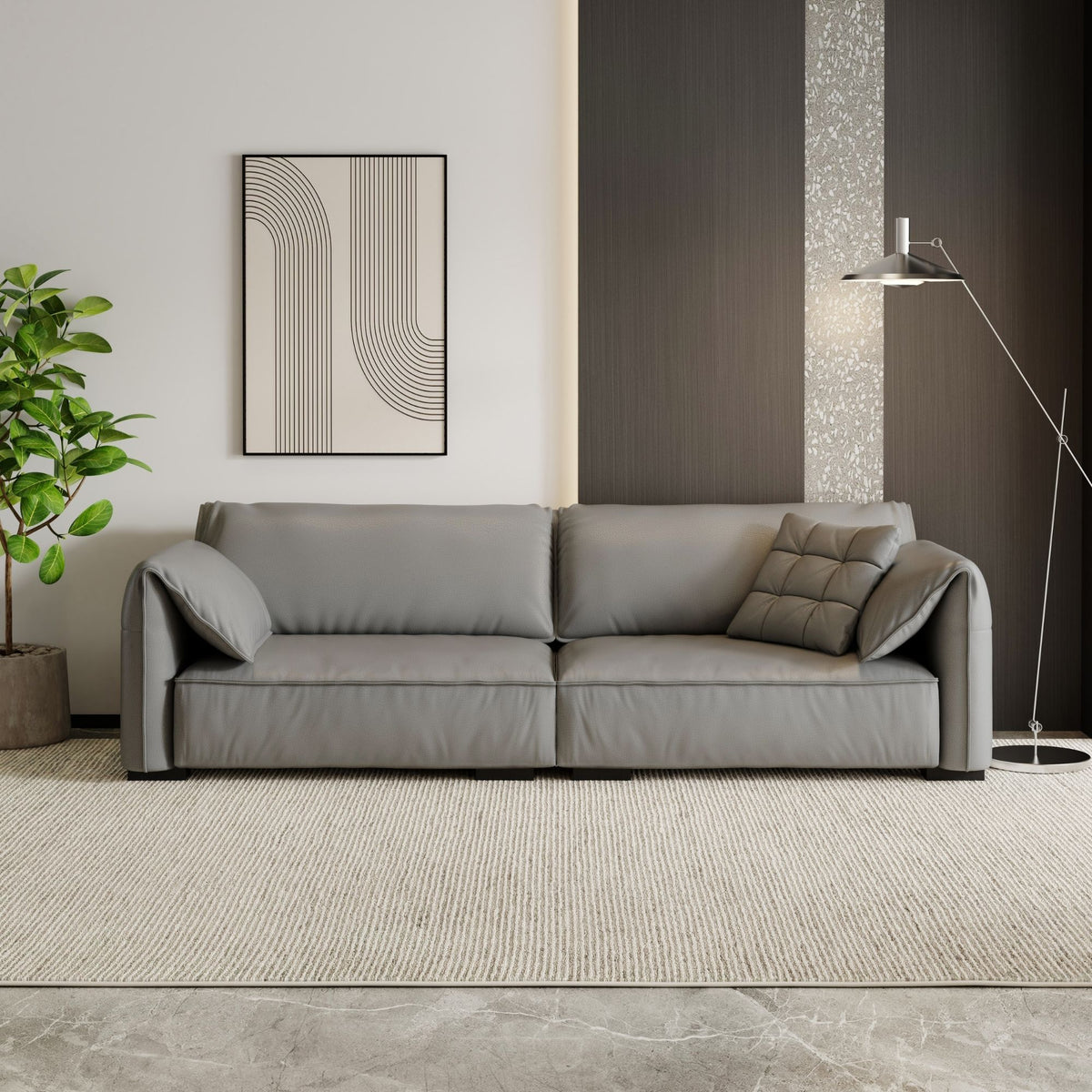 Gray sectional sofa in a modern living room with a plant and abstract art on the wall.