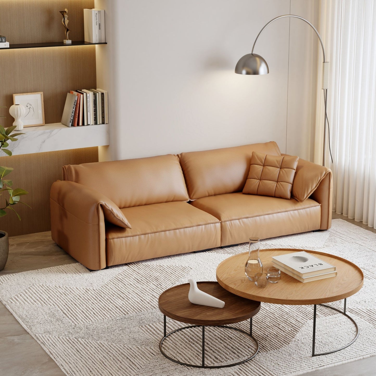 Modern living room with a brown leather sofa and round coffee tables.