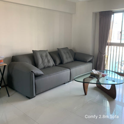 4 seater Comfy grey half leather sofa in a living room with coffee table