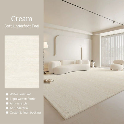 Cream-colored rug in a modern living room with text highlighting its features.