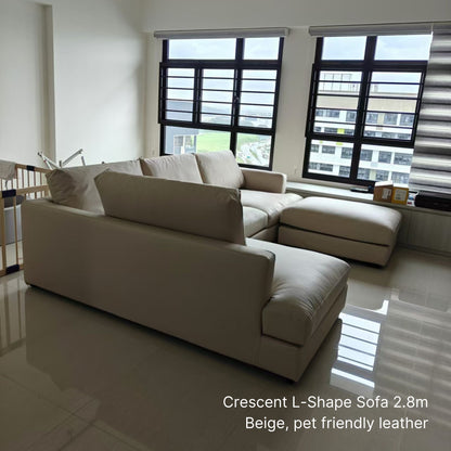 4 seater Crescent L-shaped sectional sofa with left chaise in beige pet friendly leather with matching ottoman