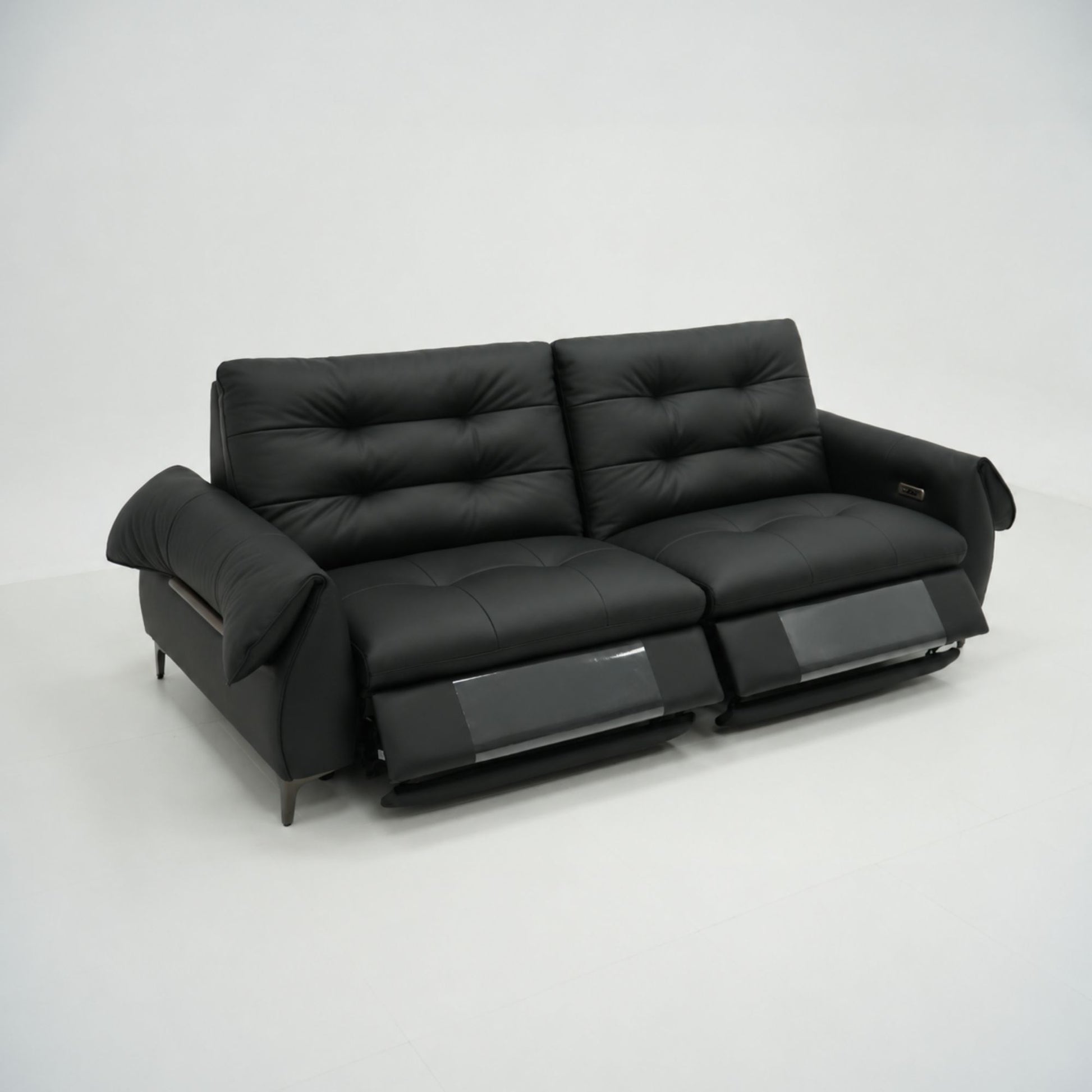 Black leather sofa on a white background