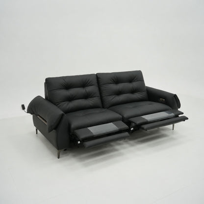 Black leather sofa with reclining feature on a white background
