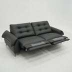 Black sofa with reclining feature on a white background