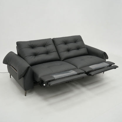 Black sofa with reclining feature on a white background