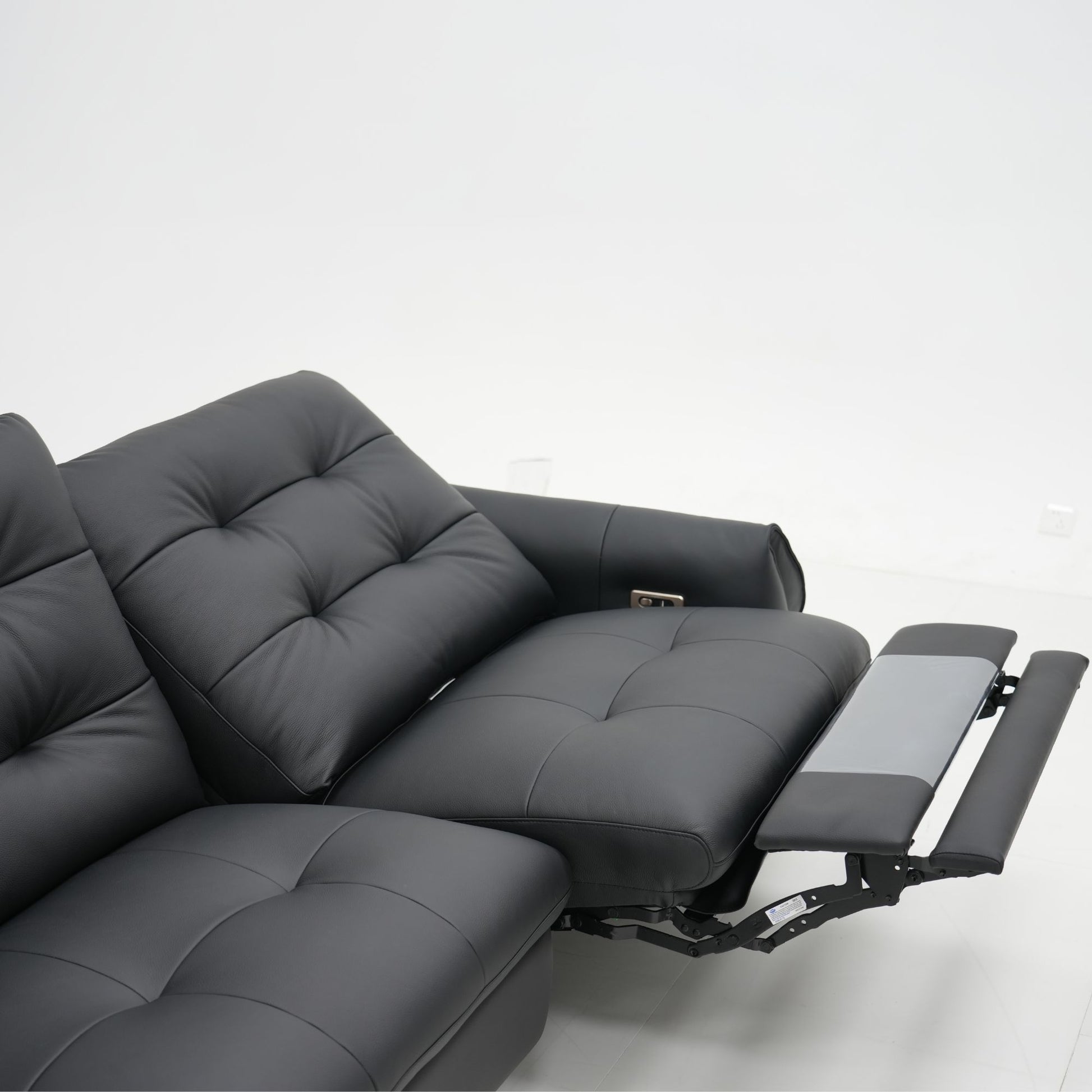 Black recliner sofa on a white background