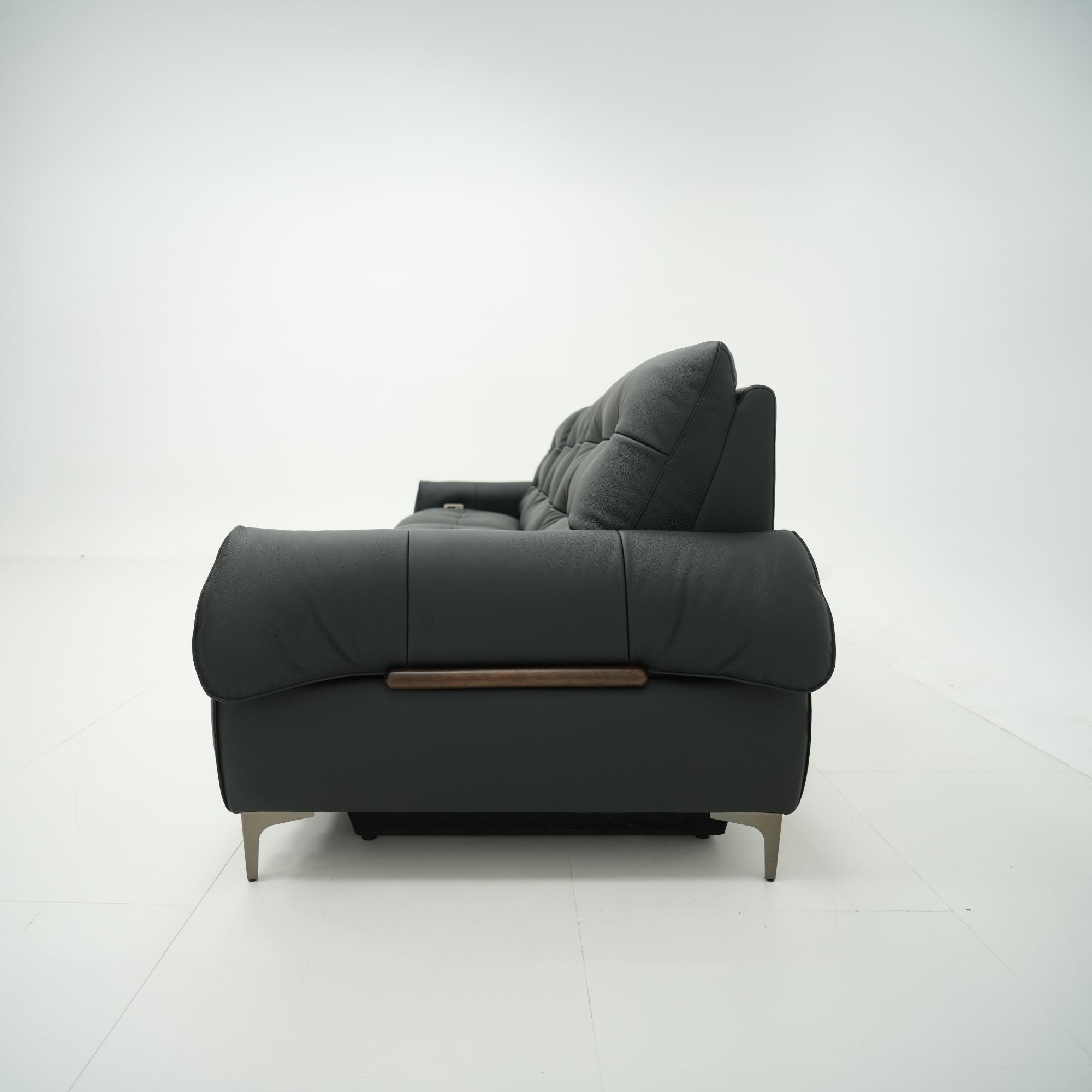 Black sofa with wooden armrest on a white background