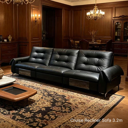 Black leather recliner sofa in a luxurious room with wooden paneling and a chandelier.