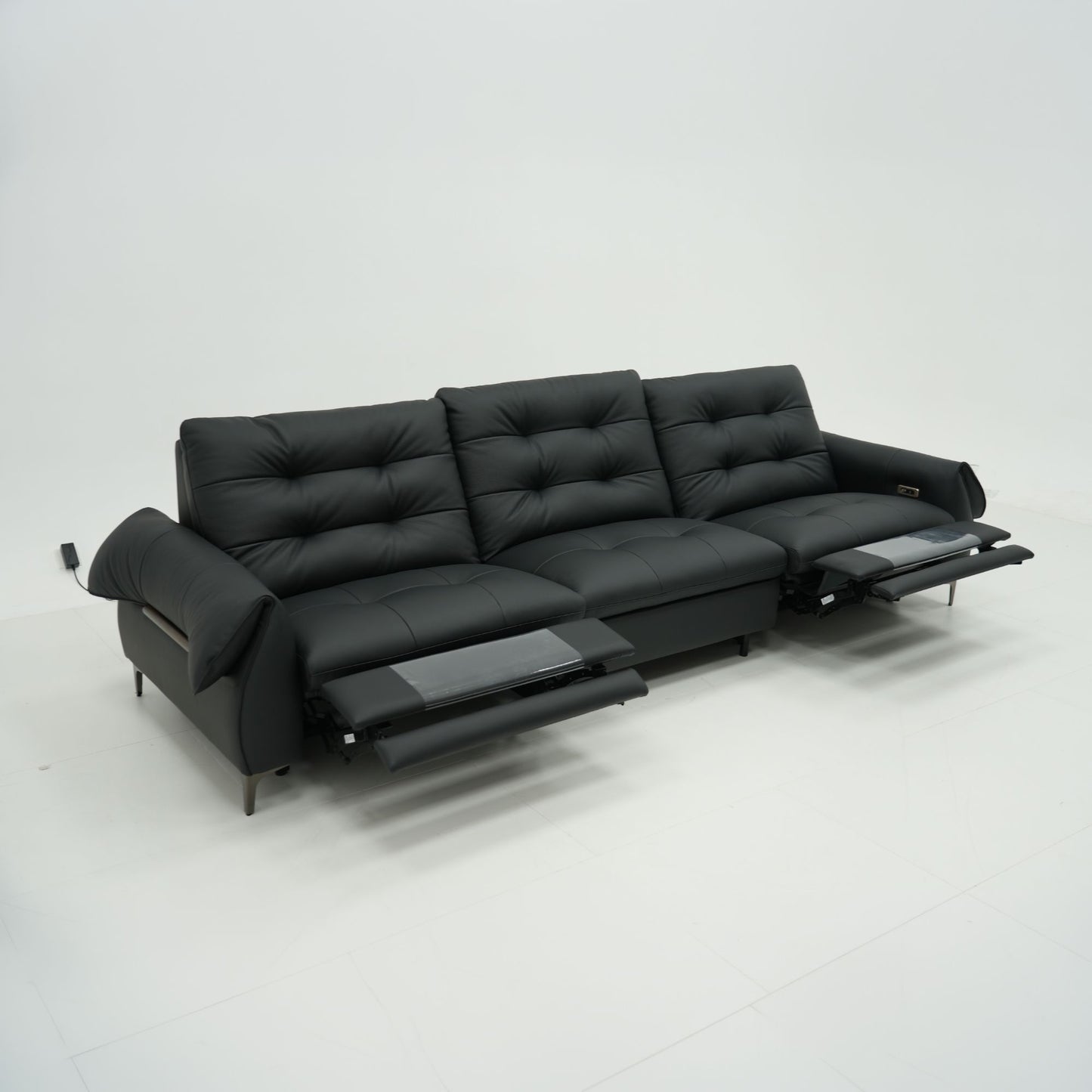 Black leather sofa on a white background