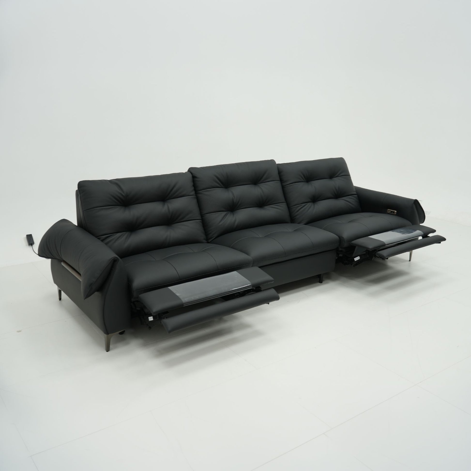 Black leather sofa on a white background