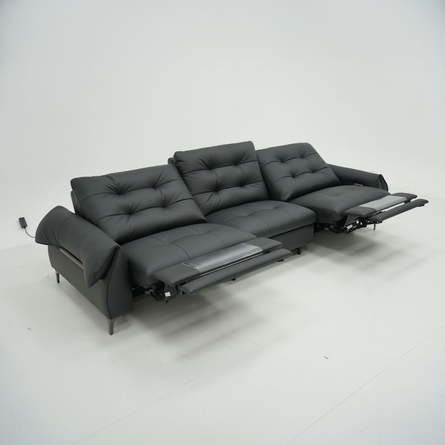 Black leather sofa on a white background
