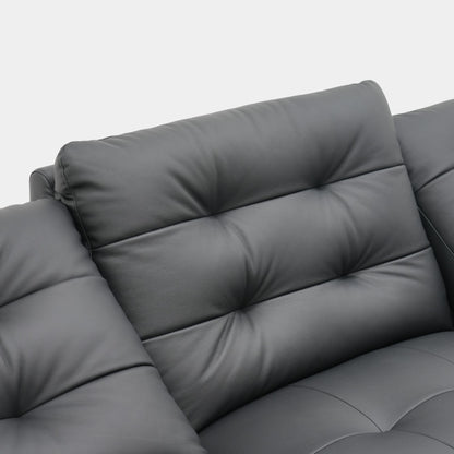 Black leather sofa close up of its backrest design on a white background