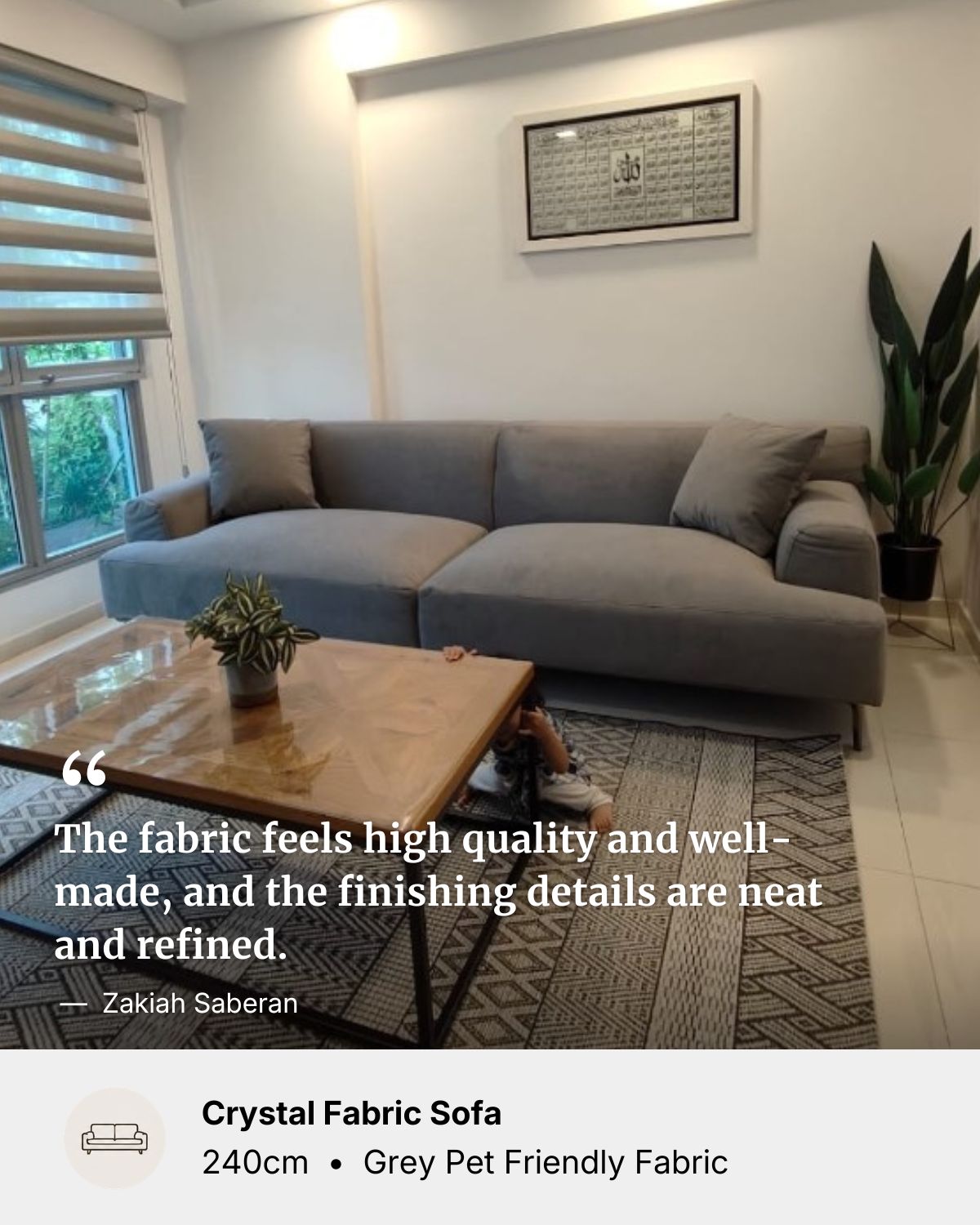 Gray pet friendly fabric sofa in a living room with a wooden coffee table and decorative elements with positive customer reviews.