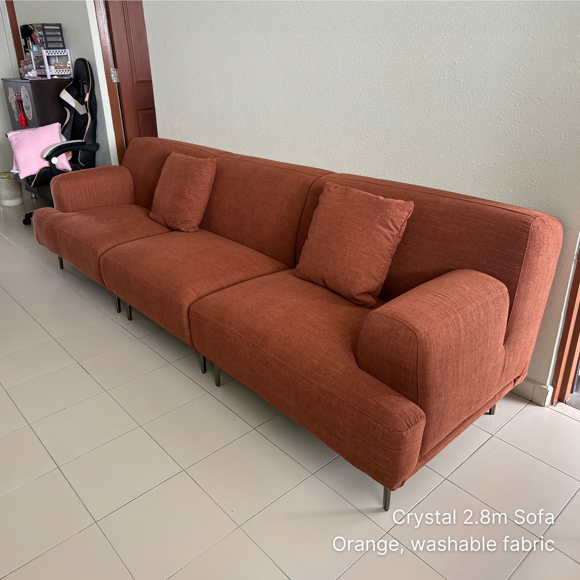 Crystal 4 seater 280cm orange washable fabric sofa in a room setting