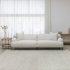 Crystal fabric sofa in white in living room with rug and side table