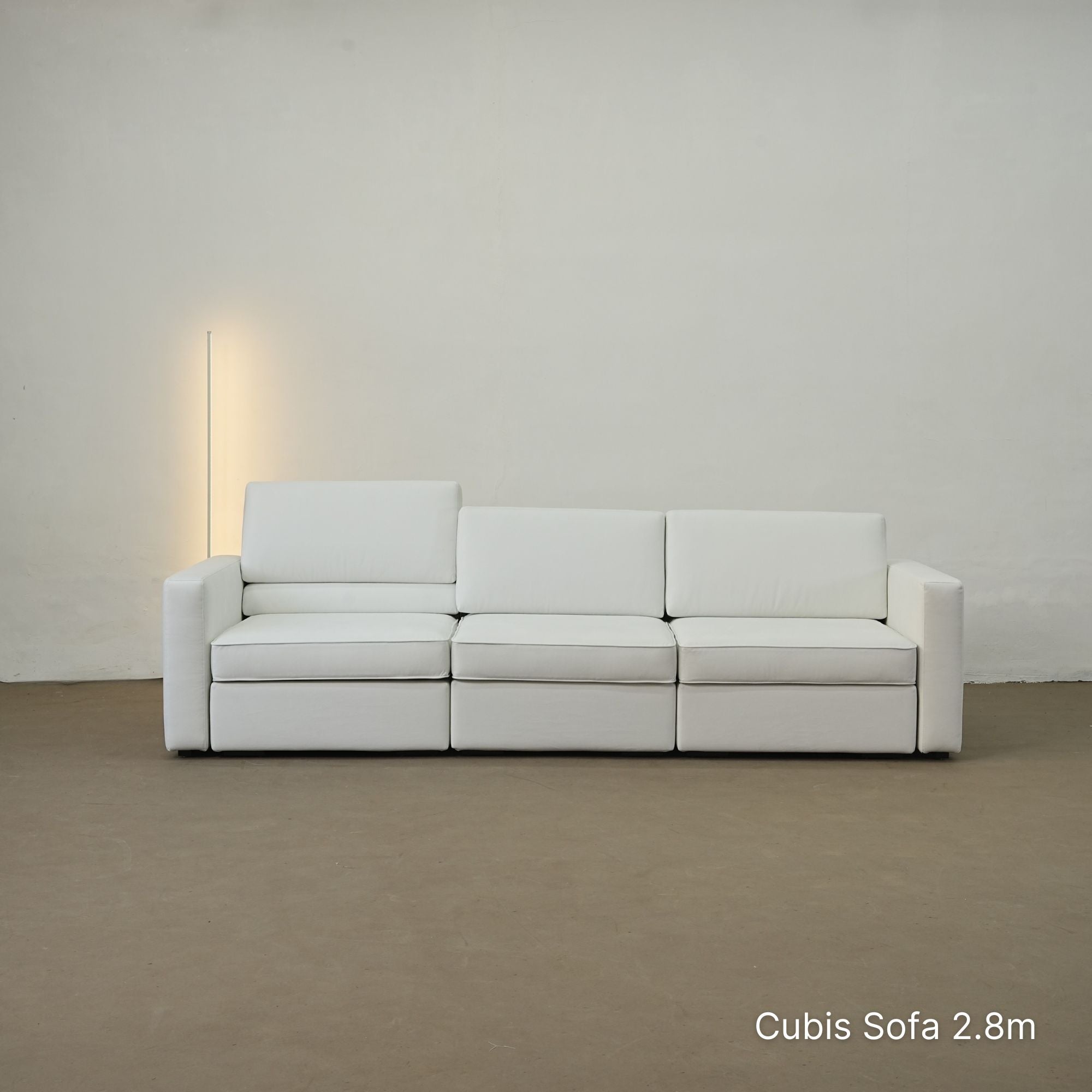 White Cubis sofa 2.8m against a plain wall with a neutral color scheme.