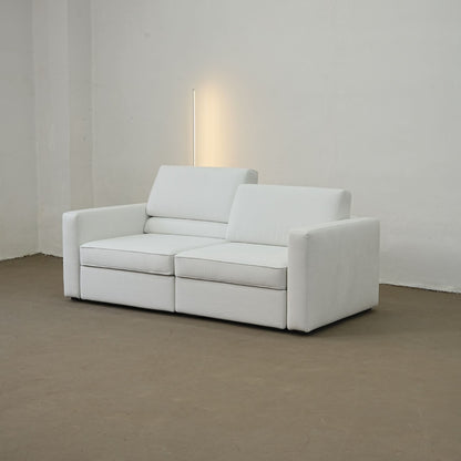 White sofa in a minimalistic room with a neutral color palette