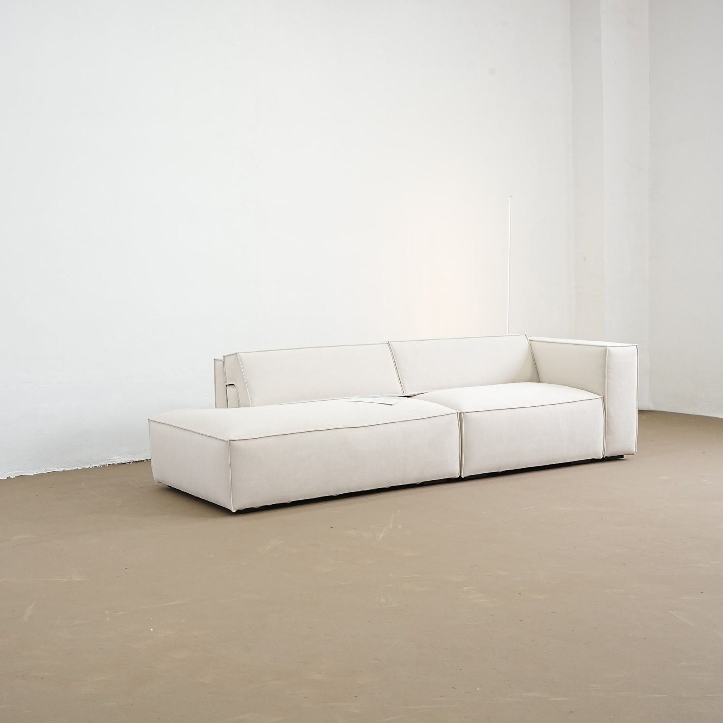diagonal view of adjustable backrest sofa with one arm one the factory floor