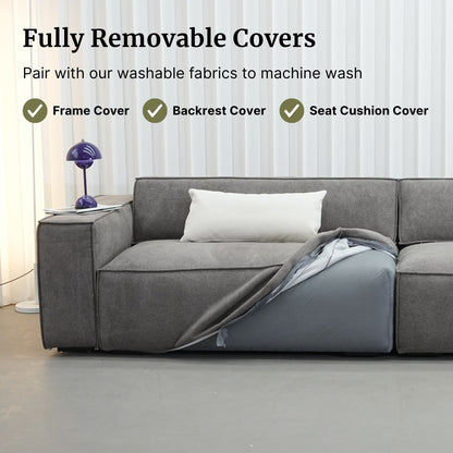 Gray sectional sofa with a blanket draped over it, featuring text about fully removable covers.