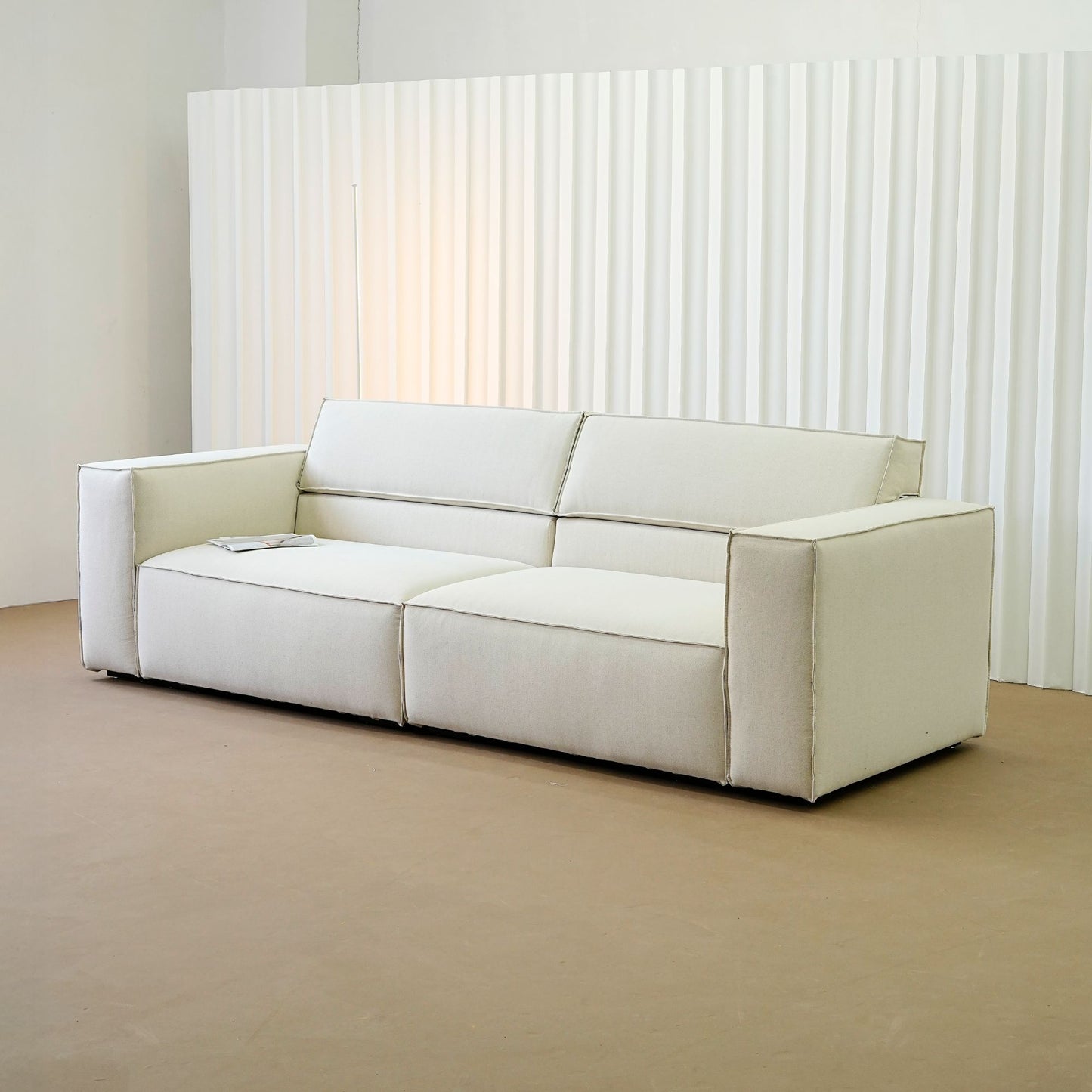 Cubix fabric adjustable backrest sofa in beige washable fabric, photo taken on the factory floor