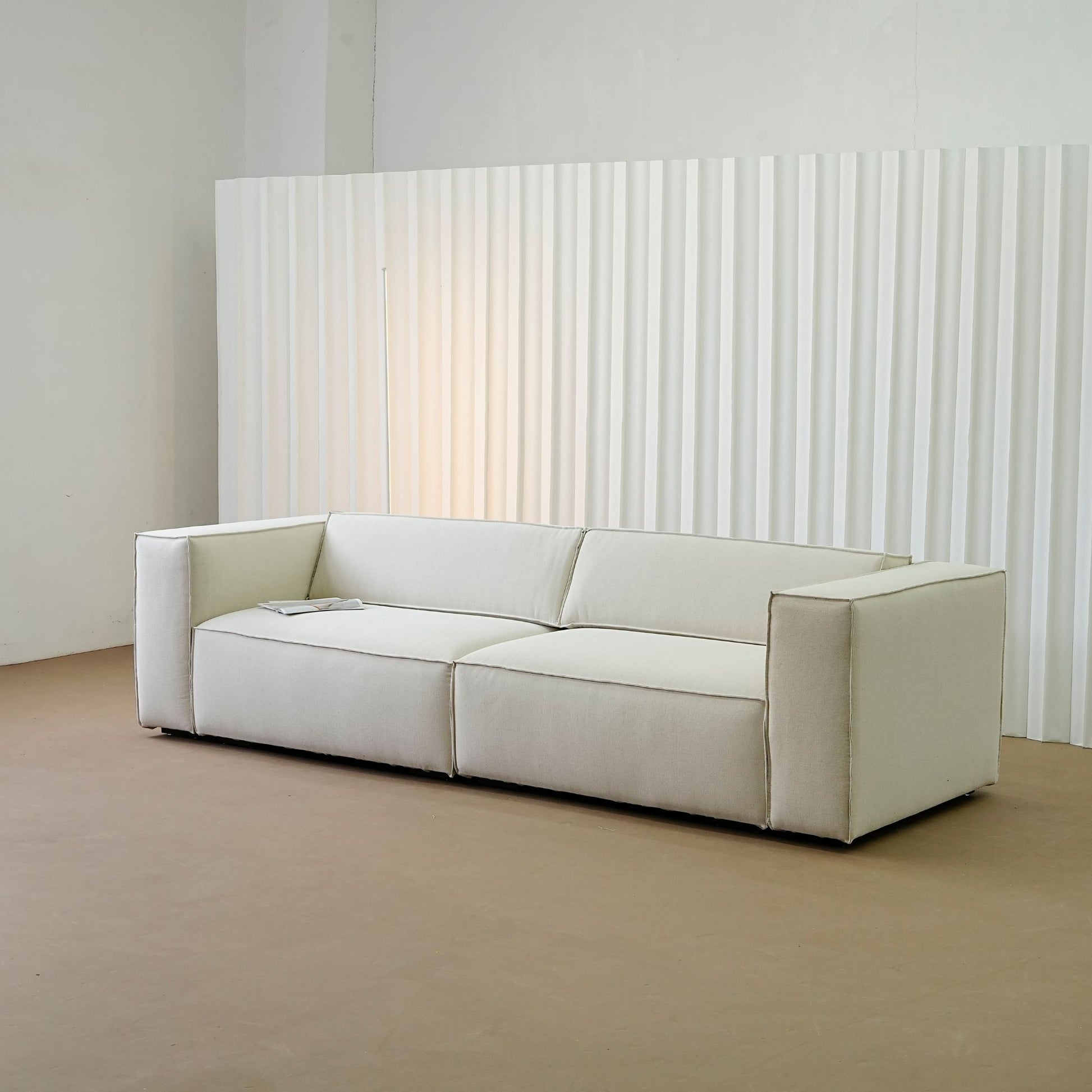 Cubix fabric adjustable backrest sofa in beige washable fabric, photo taken on the factory floor