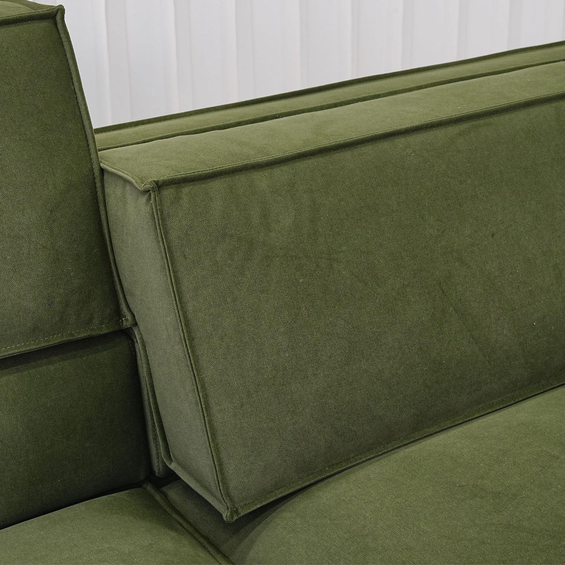 Close up photo of adjustable backrest portion of Cubix fabric adjustable backrest sofa in green pet friendly fabric