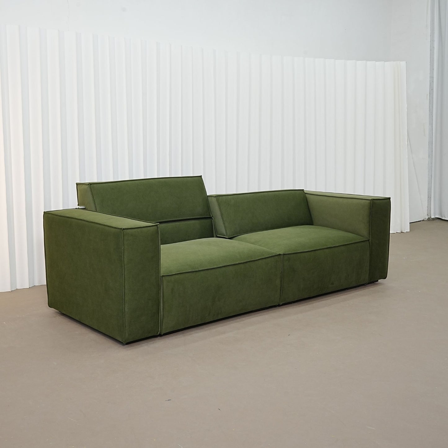 Cubix fabric adjustable backrest sofa in green pet friendly fabric, photo taken on the fabric floor