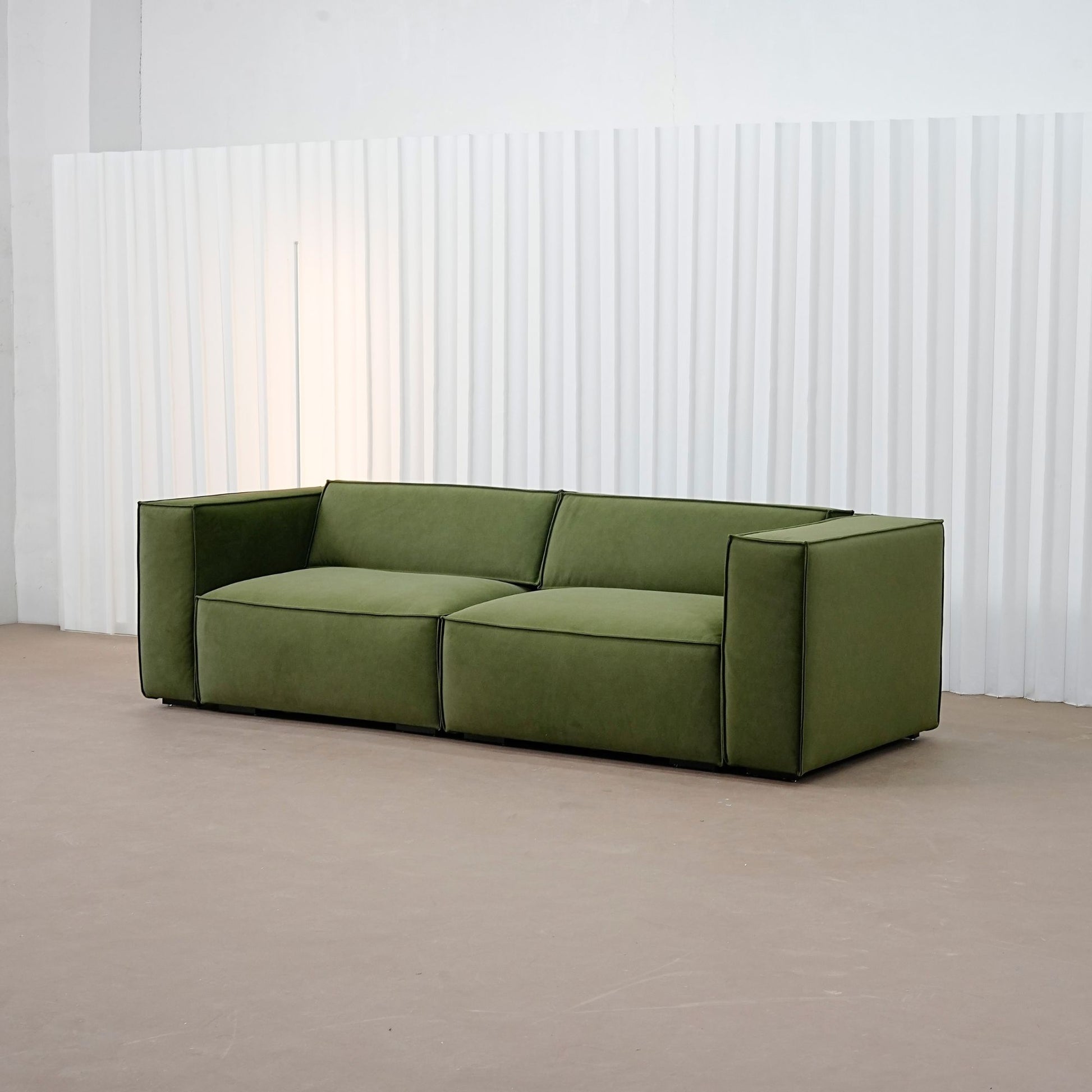 Cubix fabric adjustable backrest sofa in green pet friendly fabric, photo taken on the fabric floor