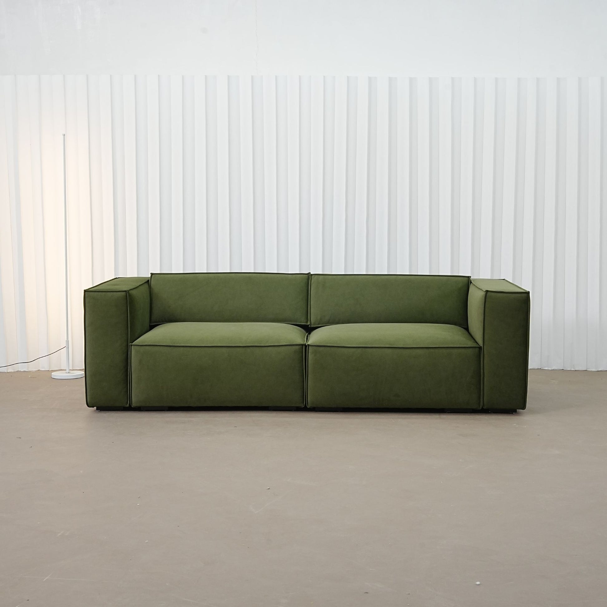 Cubix fabric adjustable backrest sofa in green pet friendly fabric, photo taken on the fabric floor