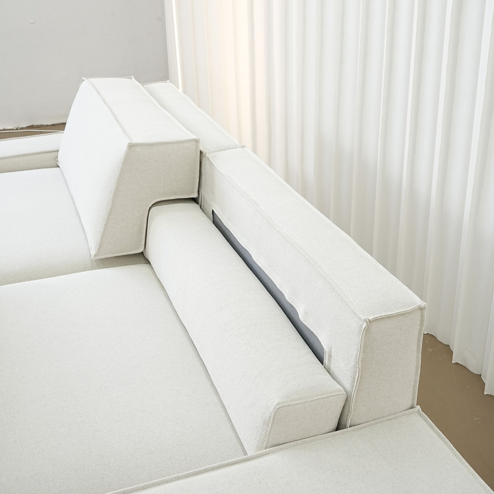 Photo showing how the adjustable backrest portion of the sofa works with the movable backrest component removed