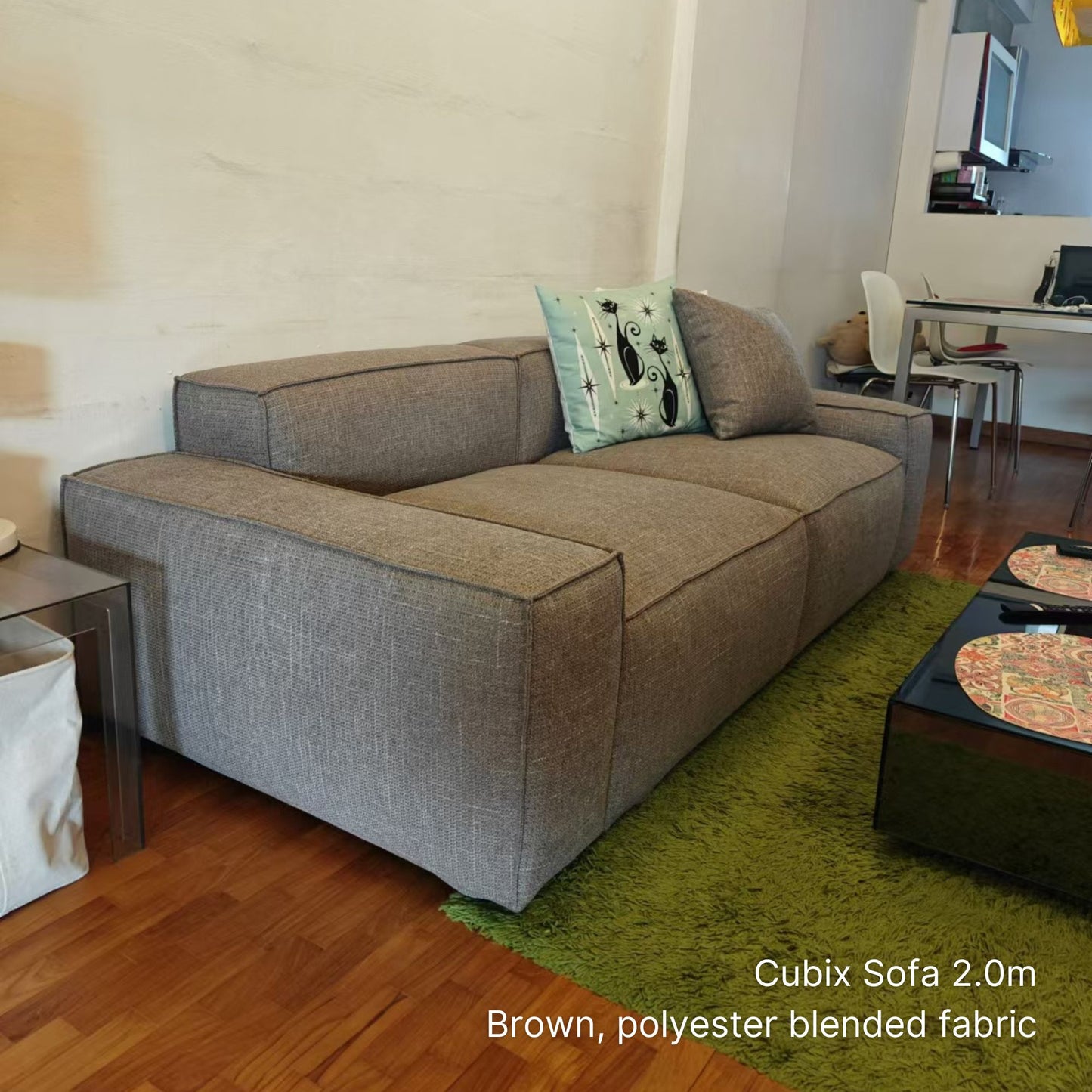 Delivered 3 seater Cubix fabric sofa in our customers living room in brown with green rug and white walls