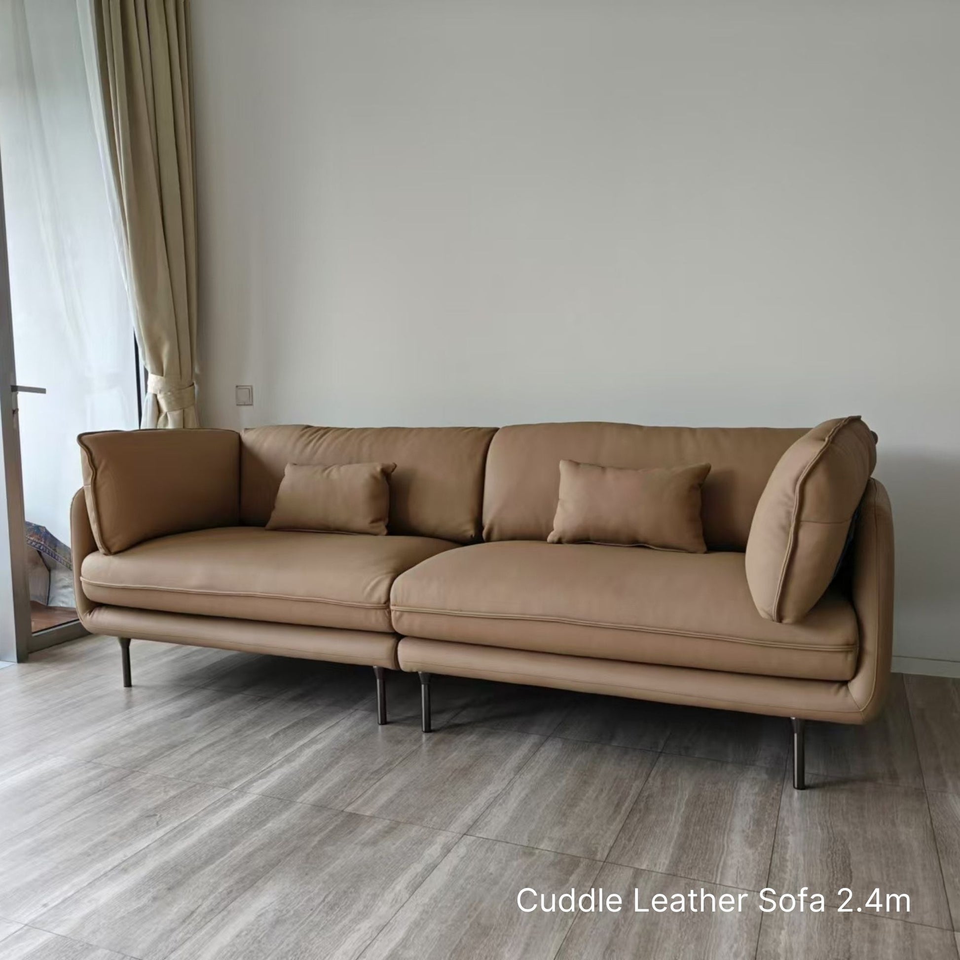 Cuddle beige leather sofa sample at 240cm