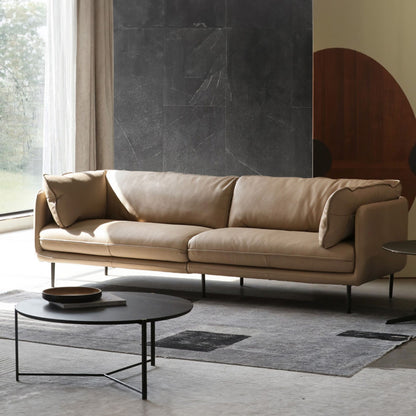 Cuddle beige leather sofa diagonal view photo shoot