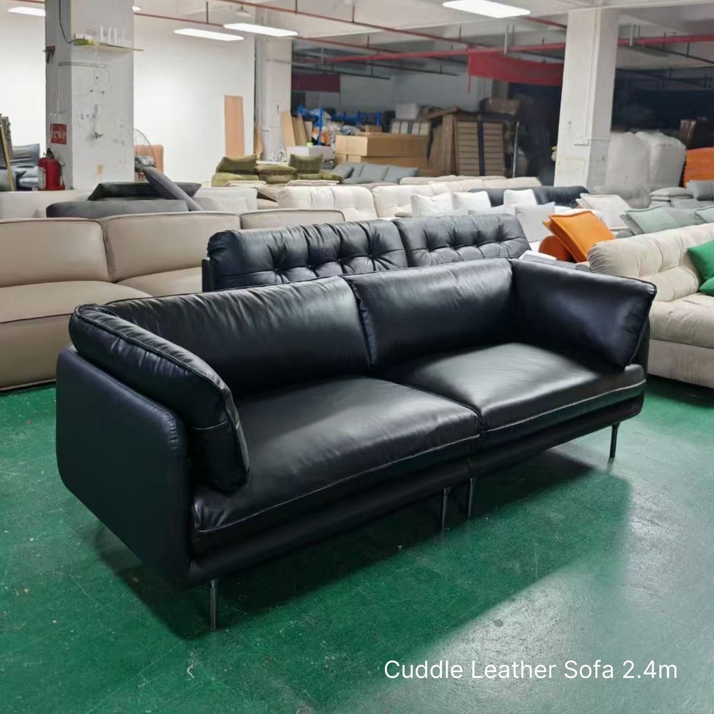 Cuddle 3 seater black leather sofa sample at 240cm