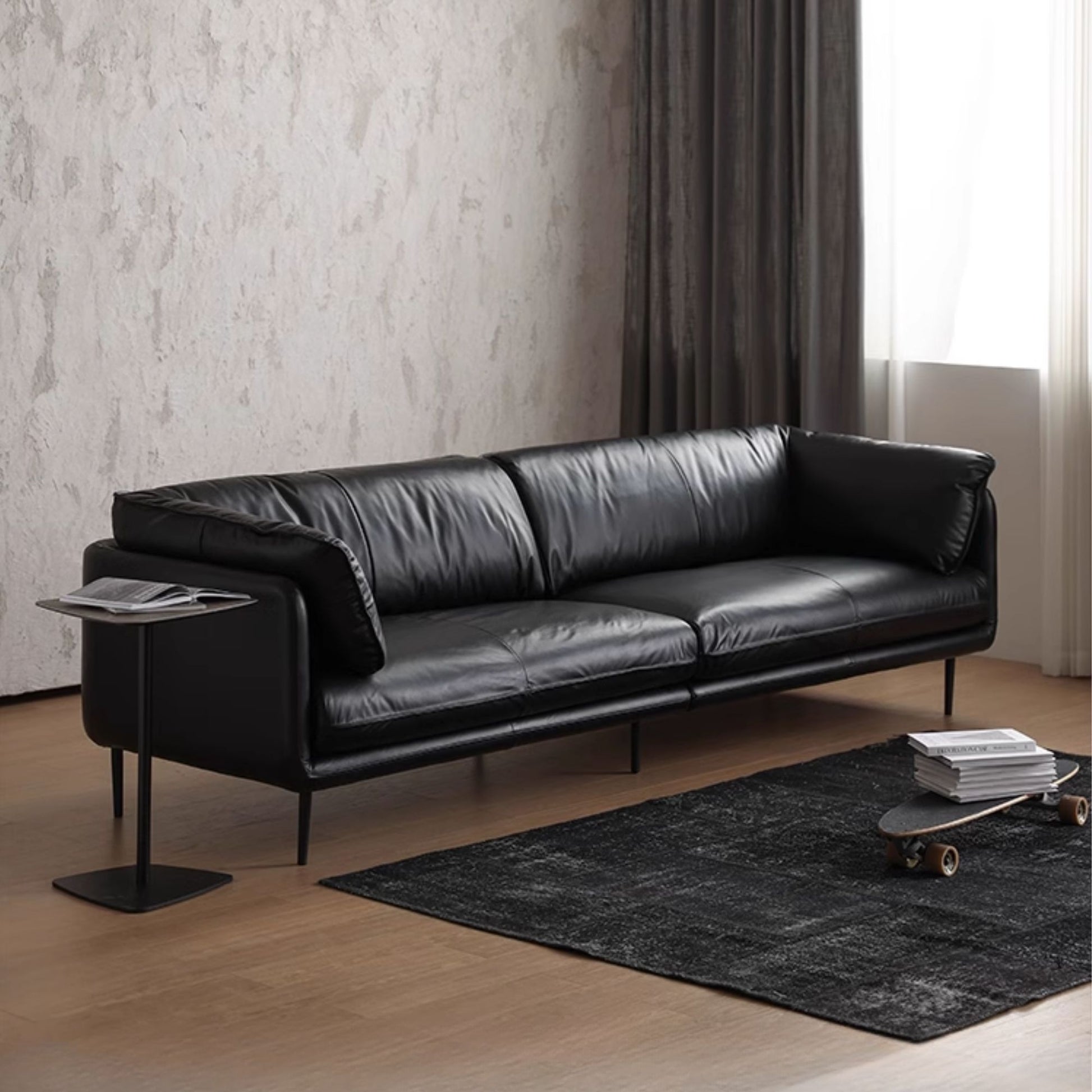 Cuddle black leather sofa diagonal view photo shoot
