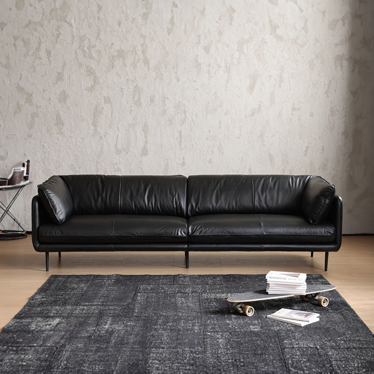 Cuddle black leather sofa front view photo shoot