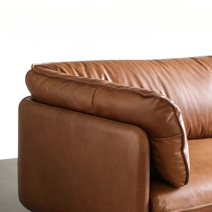 Close up view of Cuddle brown leather sofa armrest and backrest cushion portion