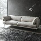 diagonal view of Cuddle leather sofa in living room setting