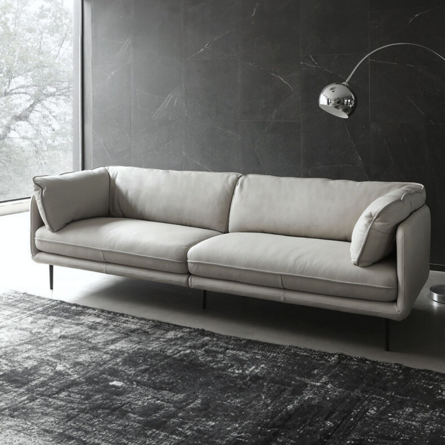 diagonal view of Cuddle leather sofa in living room setting