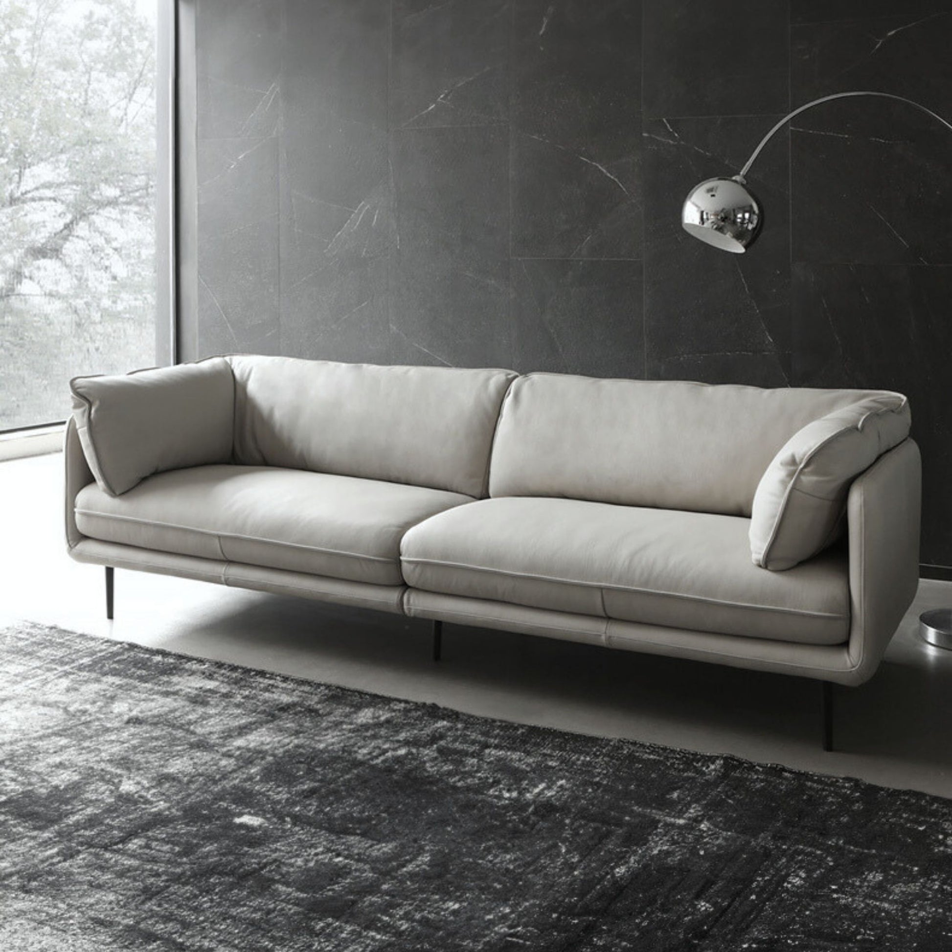 diagonal view of Cuddle leather sofa in living room setting