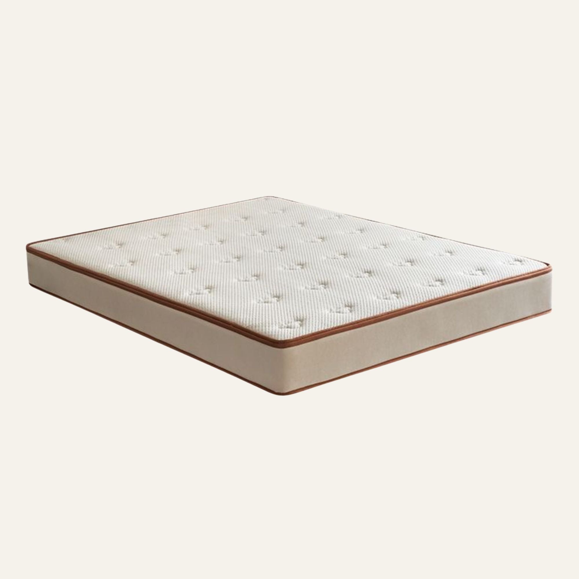 A single mattress shown at an angle on a plain light beige background. The mattress has a white tufted top surface, a beige side panel, and a thin brown edge trim.