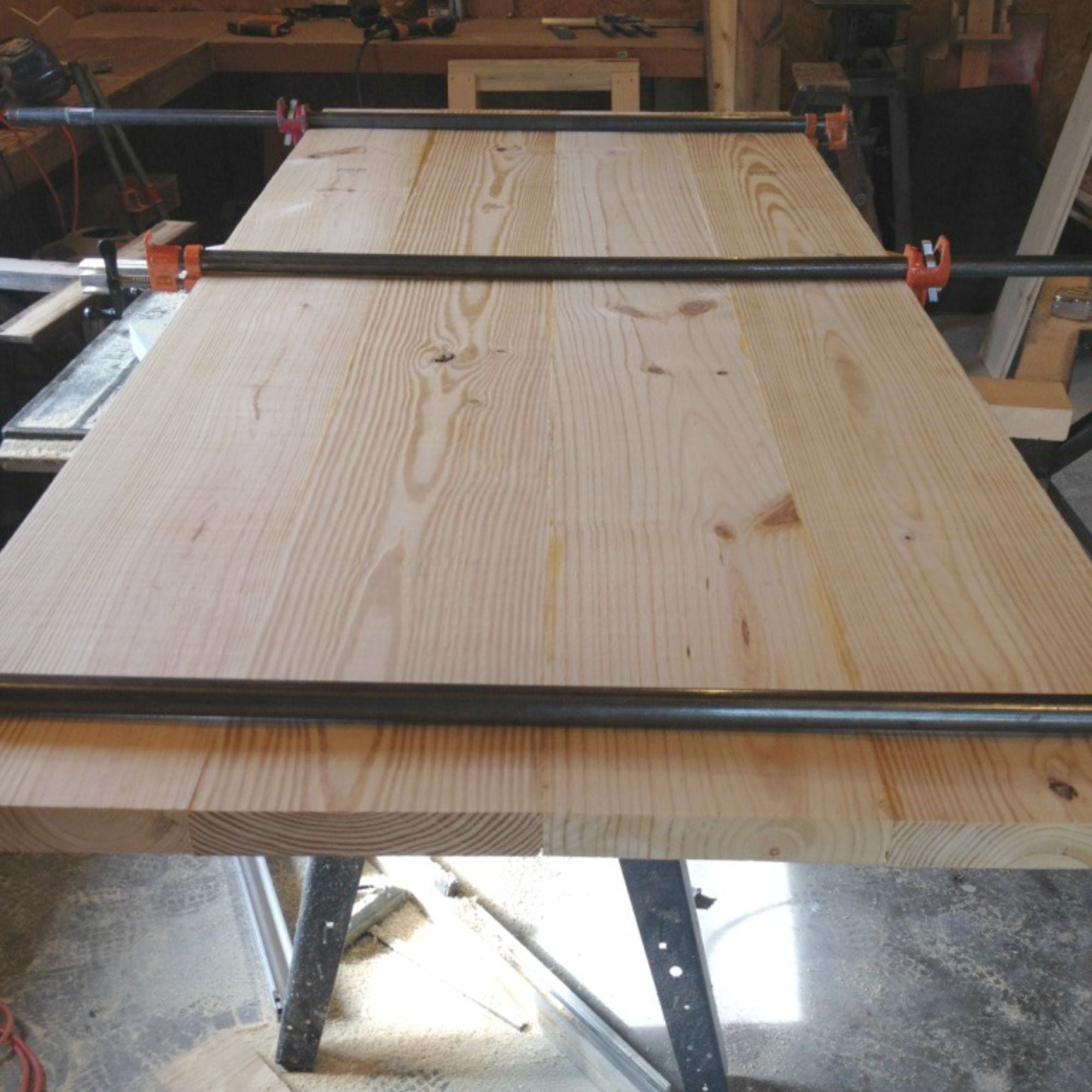 Clamp to secure wood panels together
