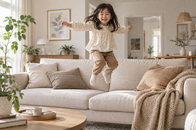 Kid jumping on the sofa