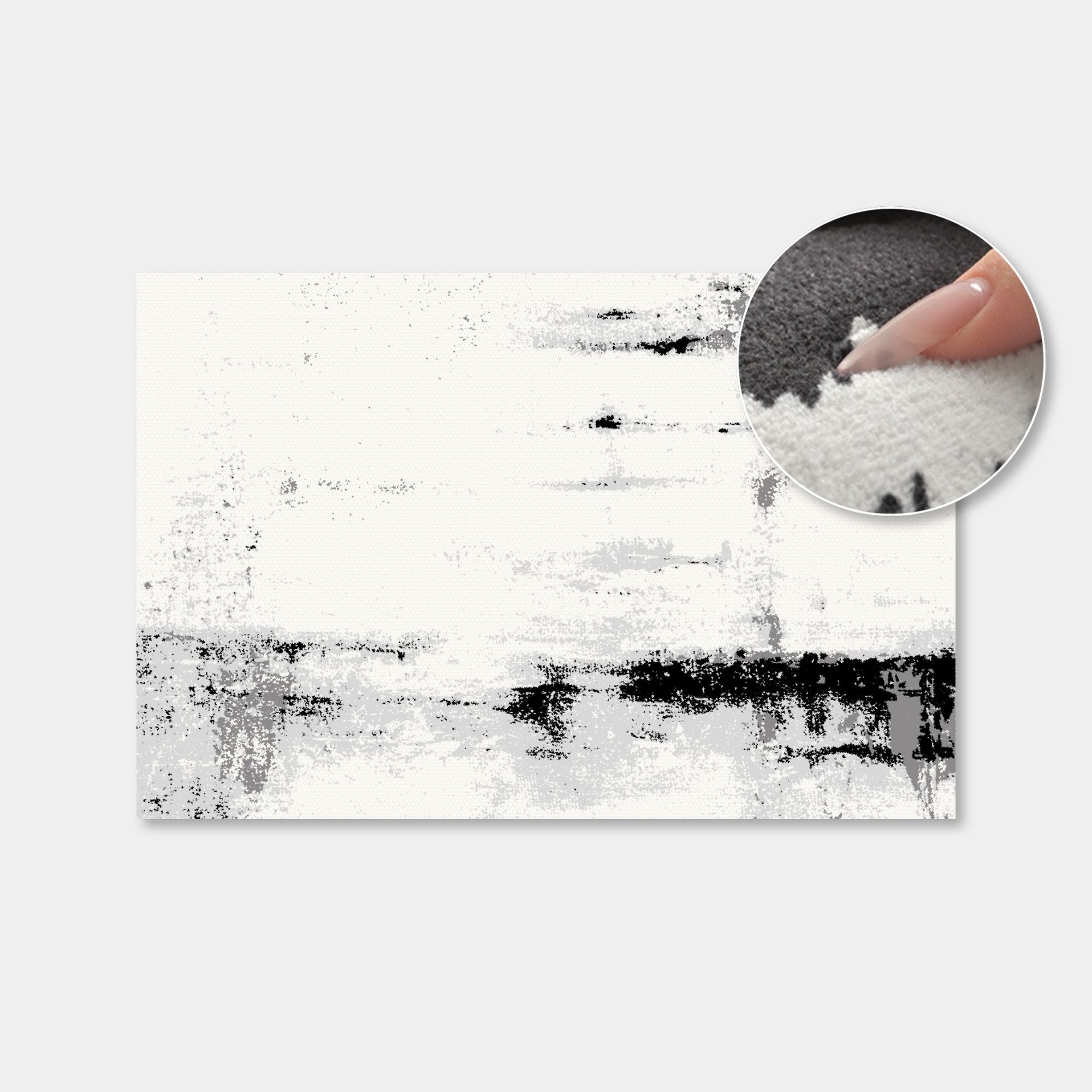 A rectangular abstract wall art print with a white and black textured brushstroke design, shown on a light gray background with a circular inset demonstrating the fabric texture.