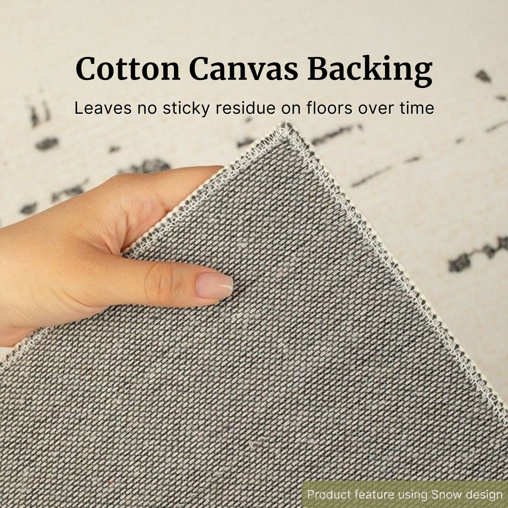 Hand holding gray fabric with text about cotton canvas backing