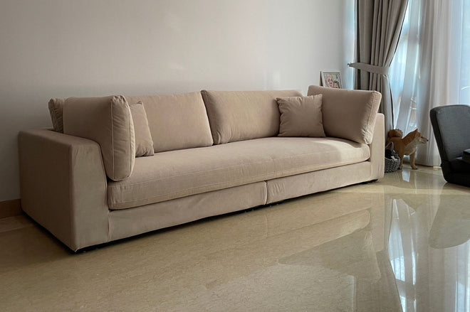 Sofa in beige pet friendly fabric with a dog nearby