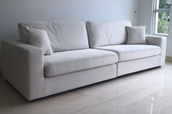 Sample sofa with flexible seat cushion and backrest cushions using Coastal fabric sofa upholstered in white pet friendly fabric as an example