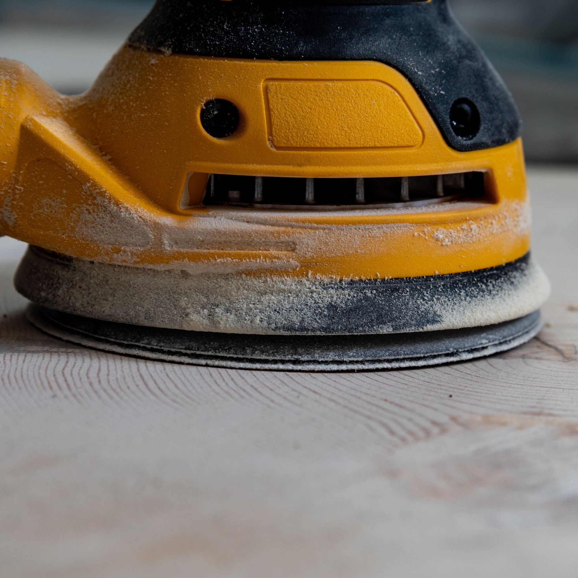 Sanding wood surface using equipment