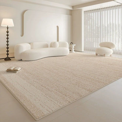 Modern living room with a beige rug, white sofa, and floor lamp.